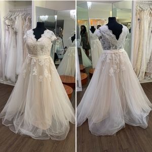 Dreamy cap sleeve lace and tulle bridal gown